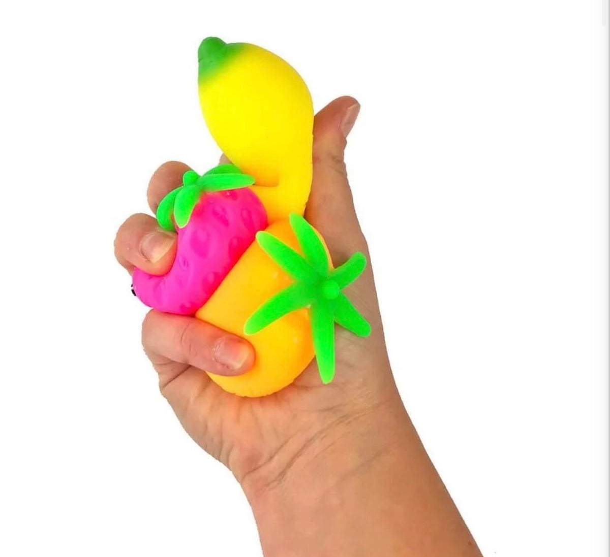 Three fruit squishies in hand